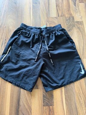 Nike Black Running Shorts with Reflective Swoosh and Stripe